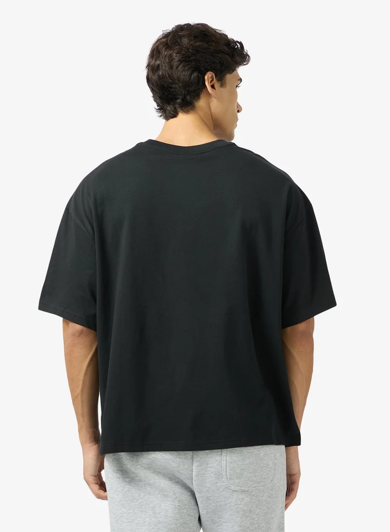 نايكي تيشيرت محبوك بقصة واسعة